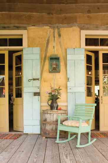 Relaxing on the kitchen porch of Maison Madeleine recalls a bygone era of simplicity.